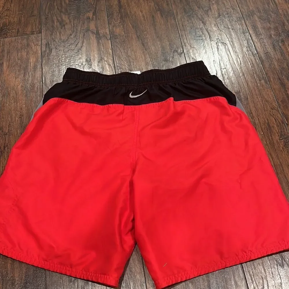 nike swim trunks size L red and black embroidered grey logo EUC with pockets